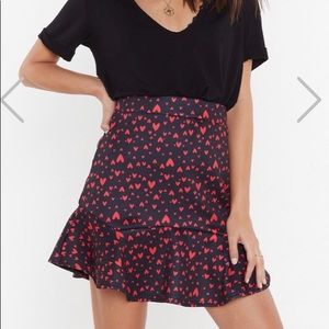 Black flirty skirt with Hearts on it